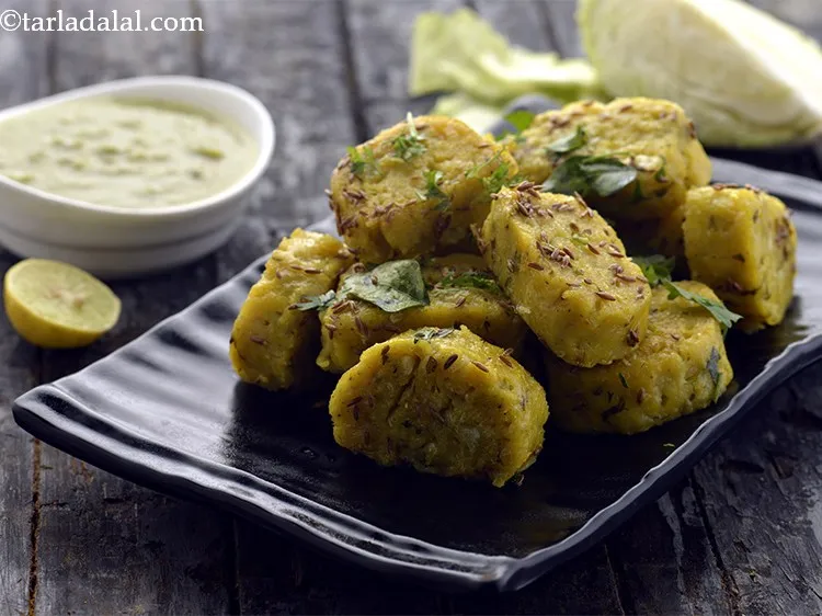Step 26 – Garnish the&nbsp;<strong>cabbage jowar muthia | Gujarati kobi jowar muthiya | Indian cabbage dumpling |&nbsp;</strong>&nbsp;with coriander …