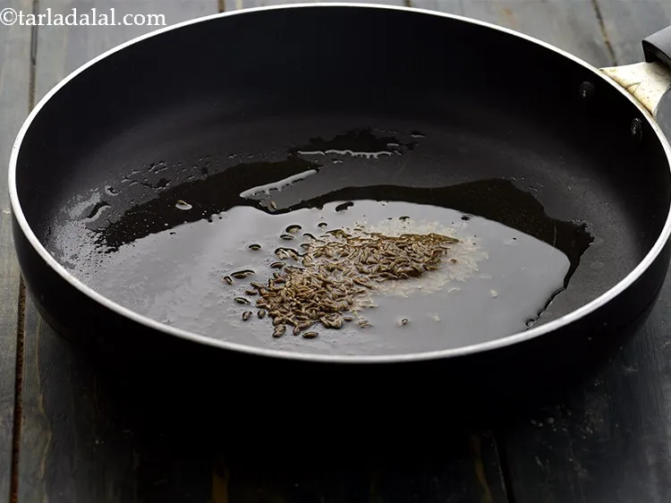 Step 21 – While tempering the&nbsp;<strong>cabbage jowar muthia | Gujarati kobi jowar muthiya | Indian cabbage dumpling |&nbsp;&nbsp;</strong>&nbsp;is …