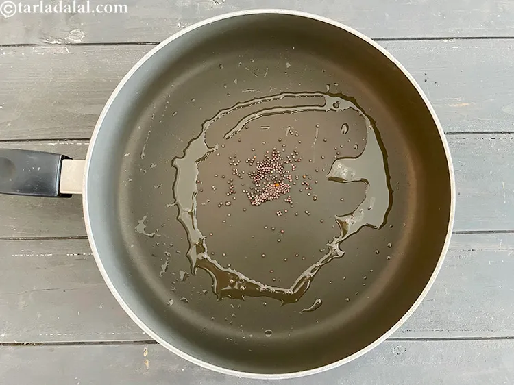 Step 8 – Add&nbsp;<meta charset="UTF-8" />3/4 tsp&nbsp;<a href="glossary-mustard-seeds-sarson-rai-sarson-ke-beej-525i">mustard seeds ( rai / sarson)</a>.