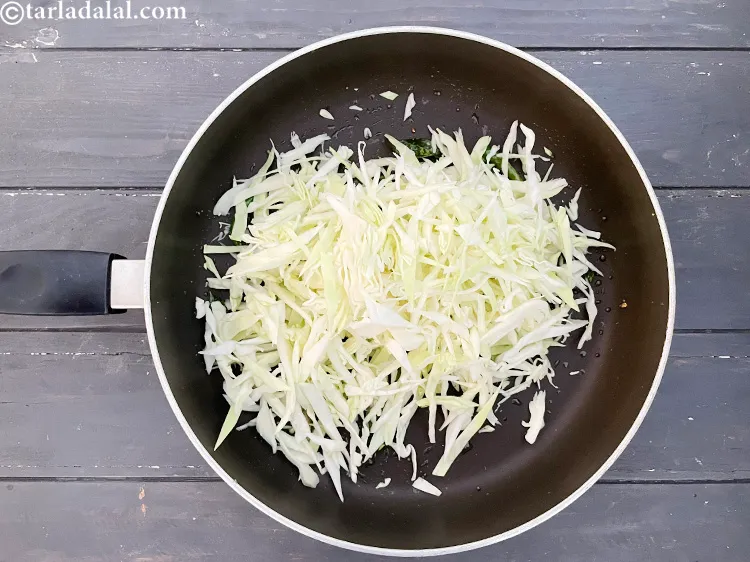 Step 14 – Add&nbsp;<meta charset="UTF-8" />3 cups&nbsp;<a href="glossary-shredded-cabbage-763i">shredded cabbage</a>.