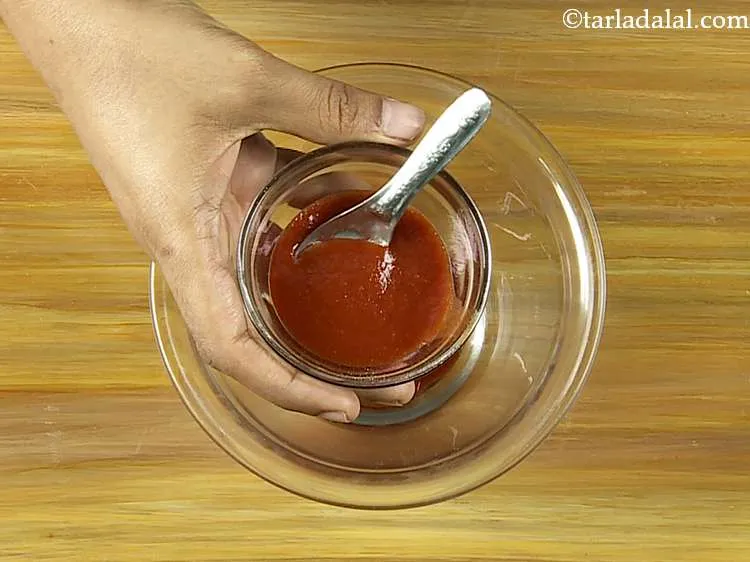 Step 3 – Add the red chilli sauce. This gives little spice.