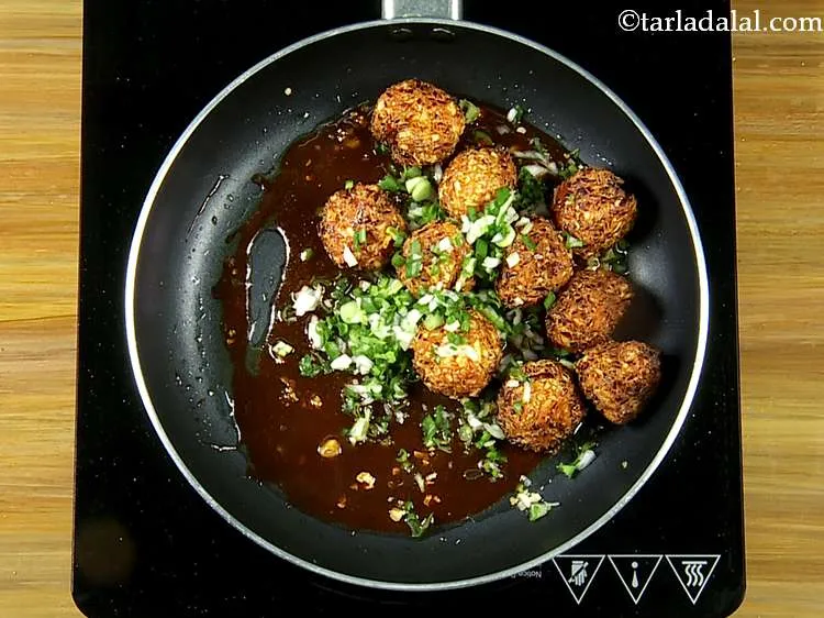 Step 32 – Add the spring onion whites and greens. This gives a very nice taste and colour …