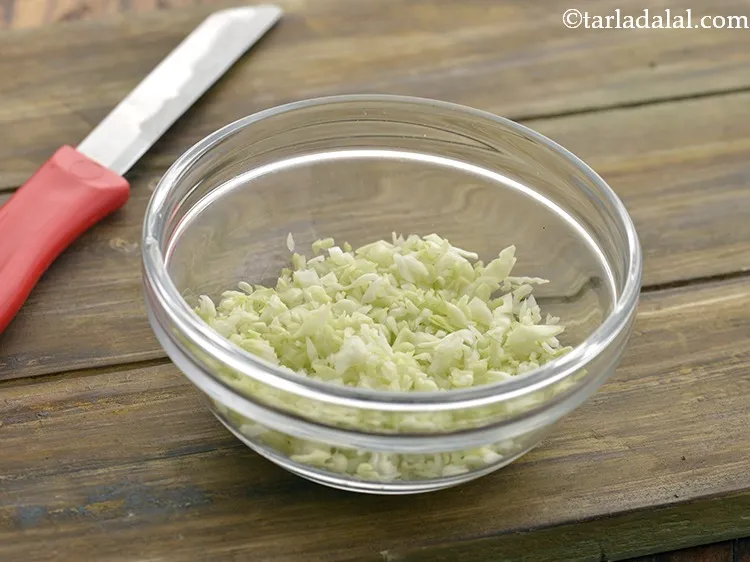 Step 15 – Using a sterilized knife chop the cabbage very finely. Keep the chopped cabbage aside.