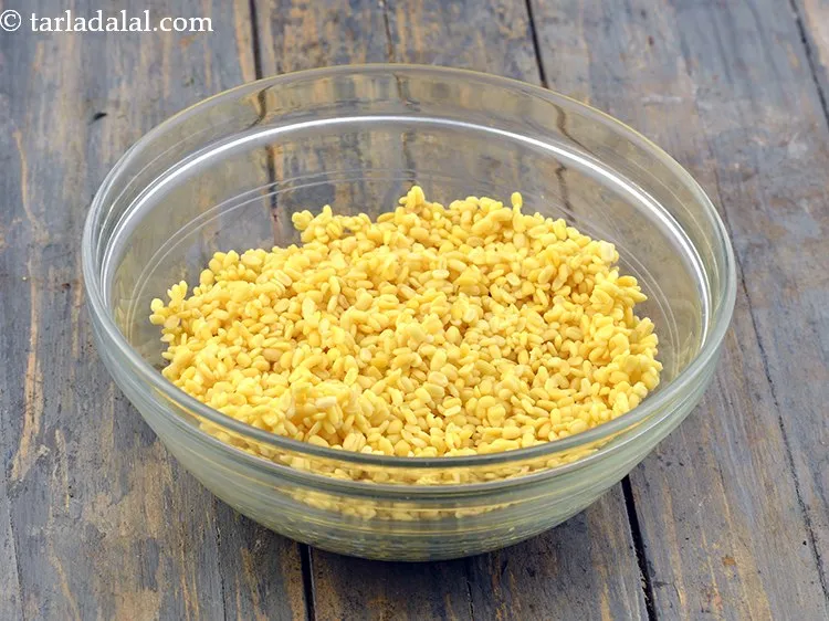 Step 32 – Add the soaked and drained yellow moong dal.