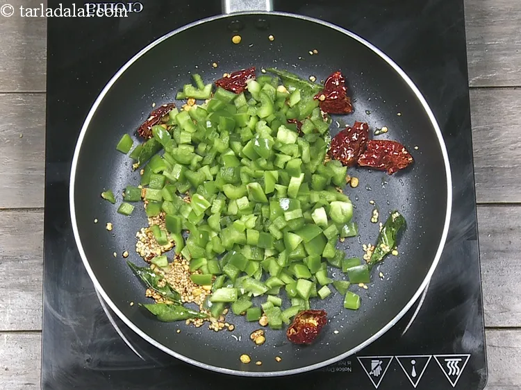 Step 12 – Add 1 cup&nbsp;<a href="https://www.tarladalal.com/glossary-chopped-capsicum-164i">chopped capsicum</a>.&nbsp;Rich in&nbsp;<a href="https://www.tarladalal.com/recipes-for-Vitamin-C-Rich-Indian-Recipes-804">vitamin C</a>,&nbsp;<a href="https://www.tarladalal.com/recipes-using-capsicum-163">capsicum</a>&nbsp;protect and maintain the lining of the …