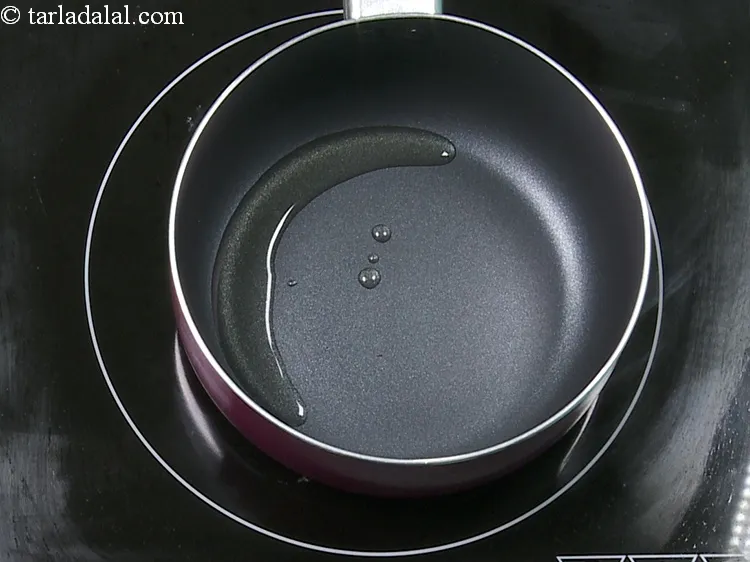 Step 19 – Then we have to temper it. Heat the remaining 2 tsp <a href="https://www.tarladalal.com/glossary-sesame-oil-til-oil-gingely-oil-til-ka-tel-1032i">sesame (til) oil</a> …