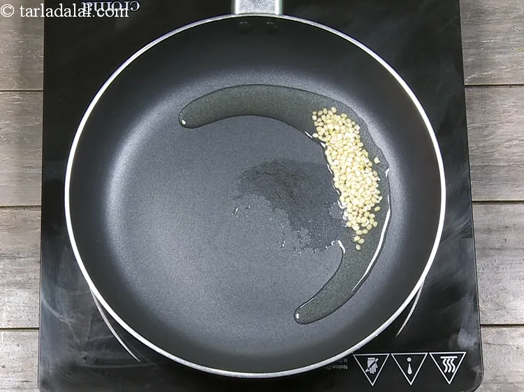 Step 4 – Add 1 tsp&nbsp;<a href="https://www.tarladalal.com/glossary-urad-dal-split-black-lentil-941i">urad dal (split black lentils)</a>.&nbsp;1 cup of cooked&nbsp;<a href="https://www.tarladalal.com/recipes-using-urad-dal-941">urad dal</a>&nbsp;gives 69.30% of …