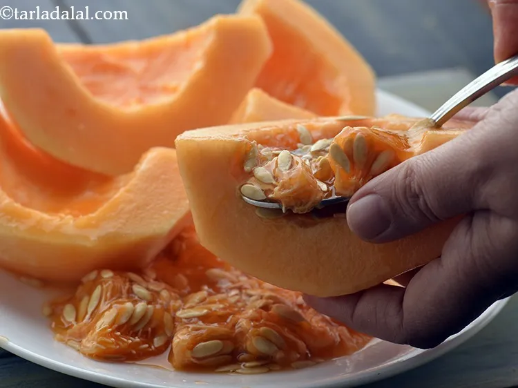 Step 18 – Scoop out all the seeds of the melon using a clean sterilized spoon and discard …