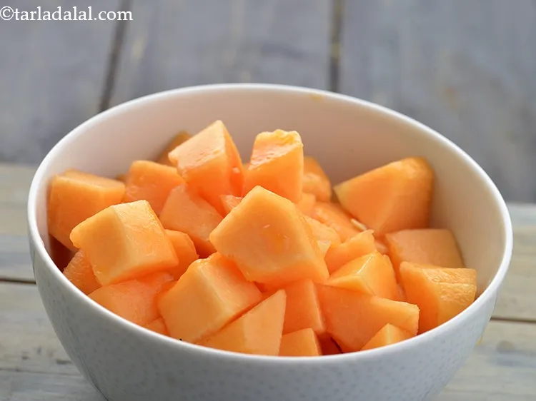 Step 19 – Cut the muskmelon into medium sized cubes using the sharp knife.&nbsp;
