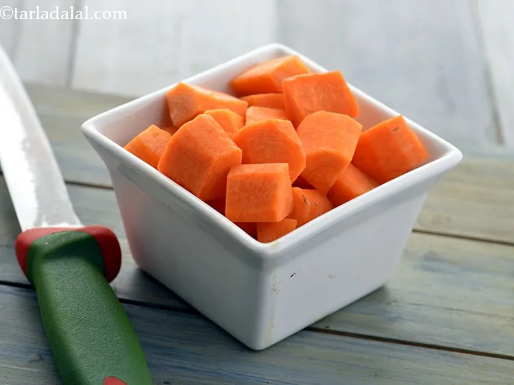 Step 12 – Using a sterilized knife chop the carrots. Chop them into medium sized pieces.