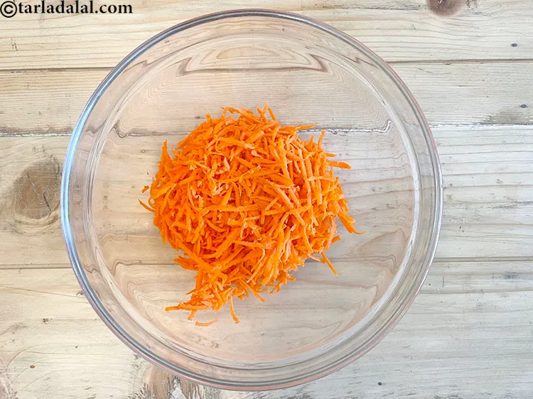 Step 3 – In a deep glass bowl put&nbsp;<meta charset="UTF-8" />3/4 cup&nbsp;<a href="glossary-grated-carrot-816i">grated carrot</a>.&nbsp;Carrots&nbsp;have the nutrient Beta Carotene …