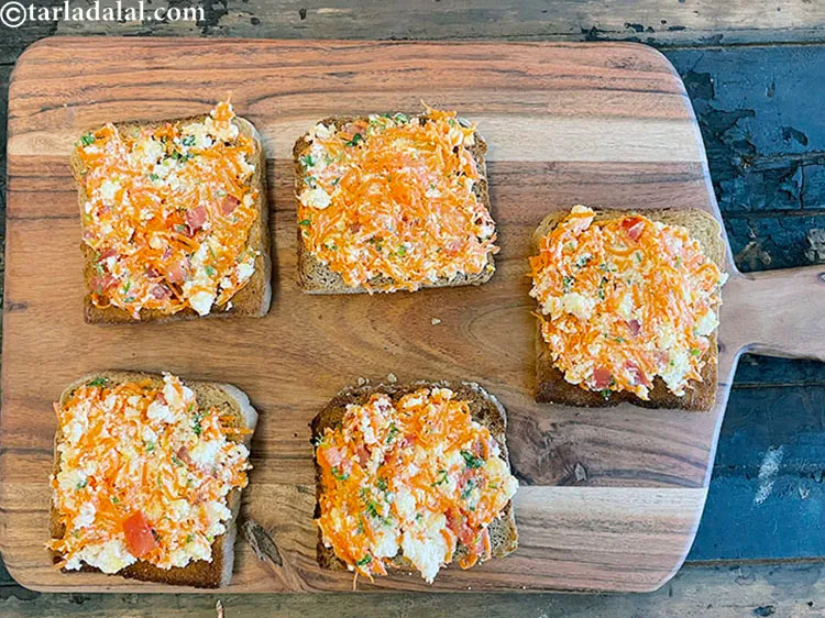 Step 13 – Place one portion of the mixture on each toast.