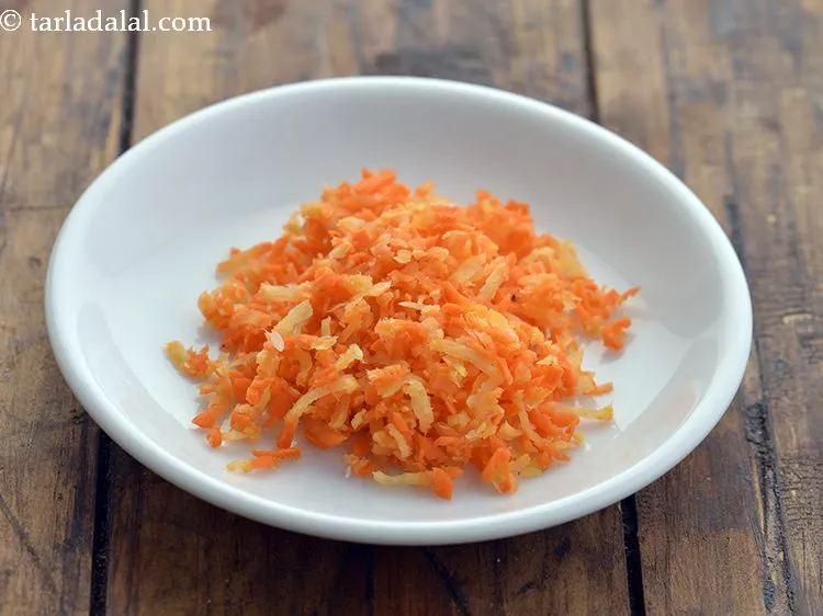 Step 7 – Using a sterilized grater, grate the carrot. Keep the grated carrot aside.