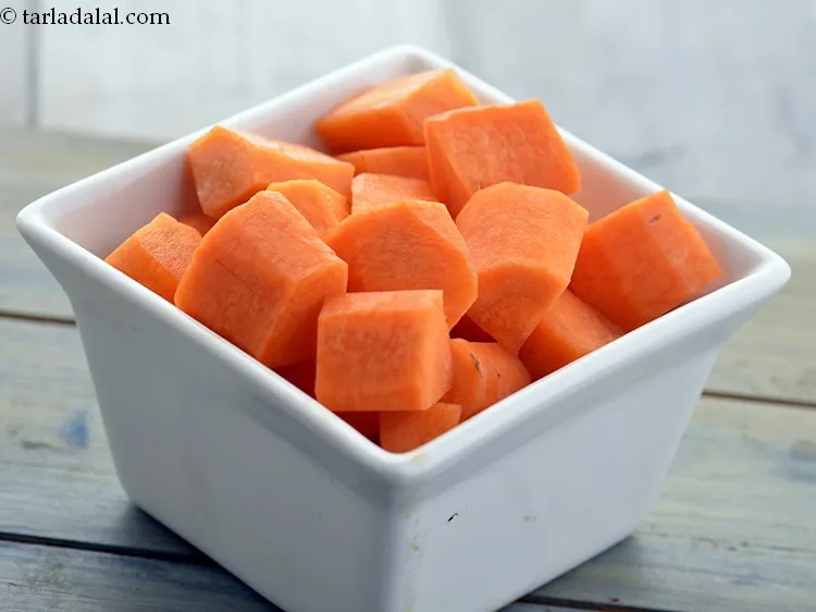 Step 16 – Then to make healthy <strong>pear apple drink</strong>, add carrot cubes also to the mixer jar.