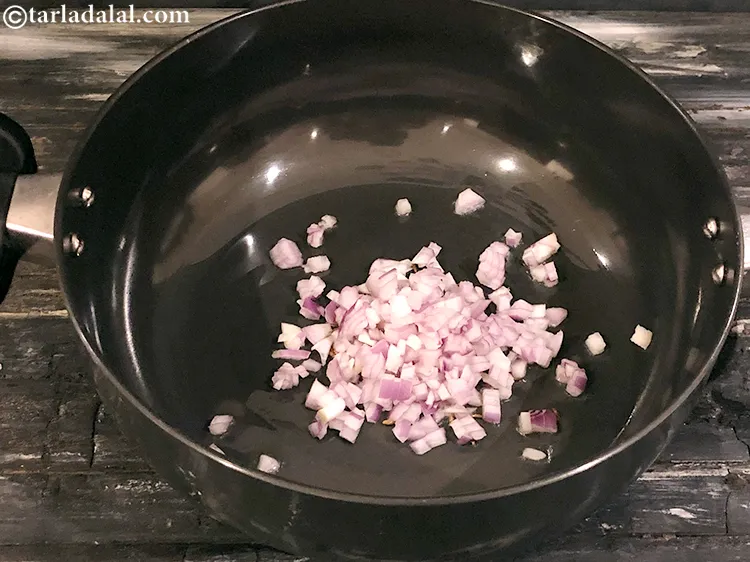 Step 3 – <meta charset="UTF-8" />When the seeds crackle, add the onions and saut&eacute; on a medium flame …