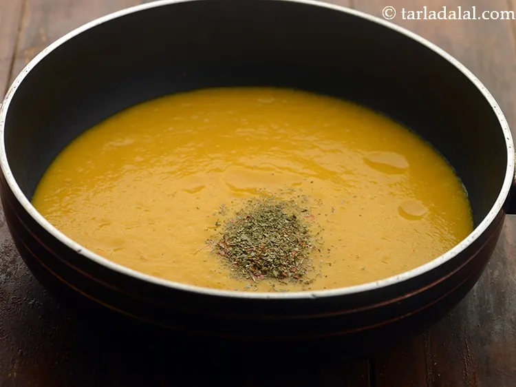 Step 20 – Add mixed herbs for <strong>onion carrot soup with herbs</strong>.