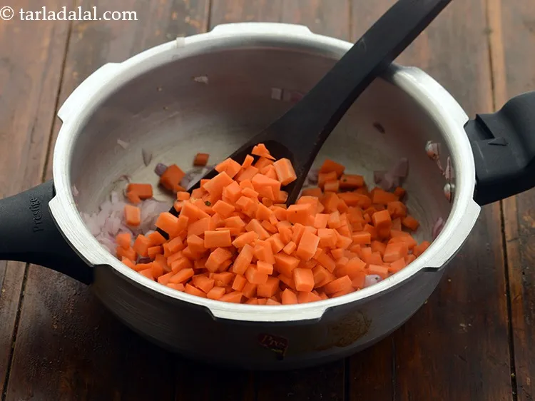 Step 10 – Add the chopped carrots. The carrots are in double quantity as compared to the onions.