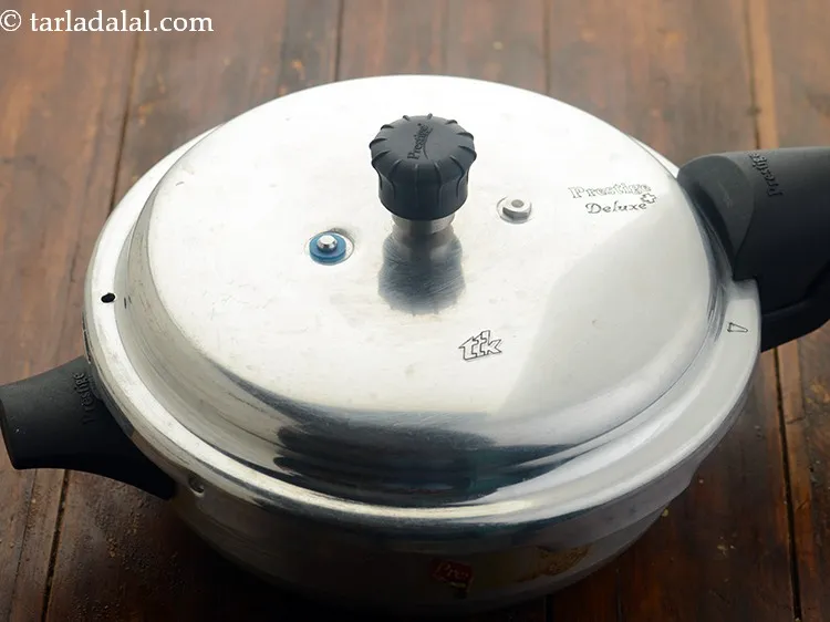 Step 15 – Close the lid of the pressure cooker and pressure cook for 3 whistles. Allow the …