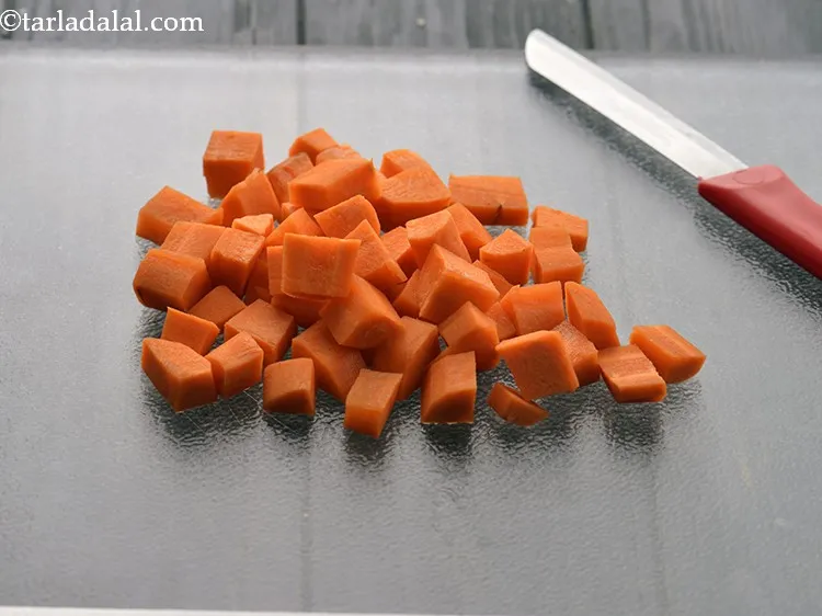 Step 12 – Using a sterilized knife chop the carrots. Chop them into medium sized pieces.&nbsp;