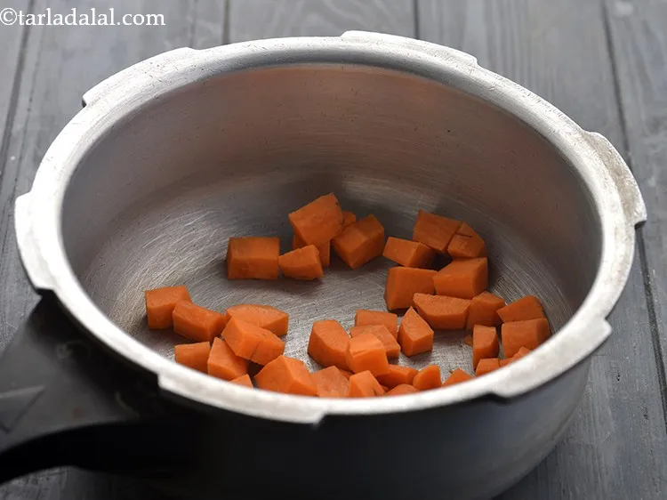 Step 13 – Add the carrot into a thoroughly cleaned pressure cooker.