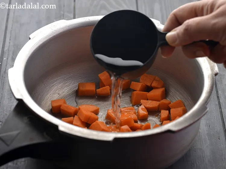 Step 14 – Add 1 cup of water to it. This is for pressure cooking.&nbsp;