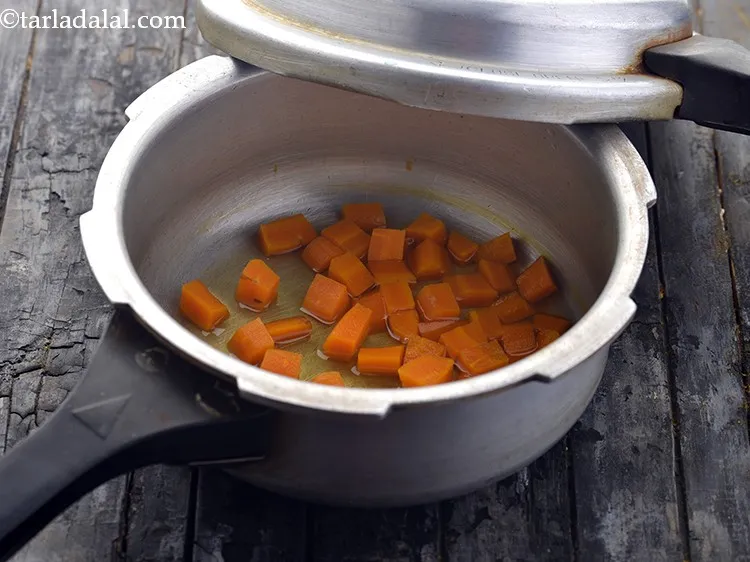 Step 15 – Pressure cook for 4 whistles. Then allow the pressure cooker to cool down slightly and …