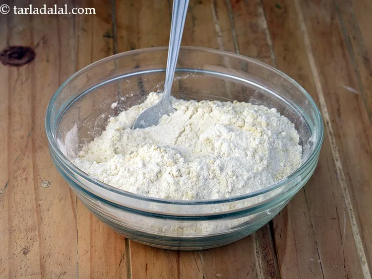 Step 28 – Add the plain flour-cashewnut mixture.