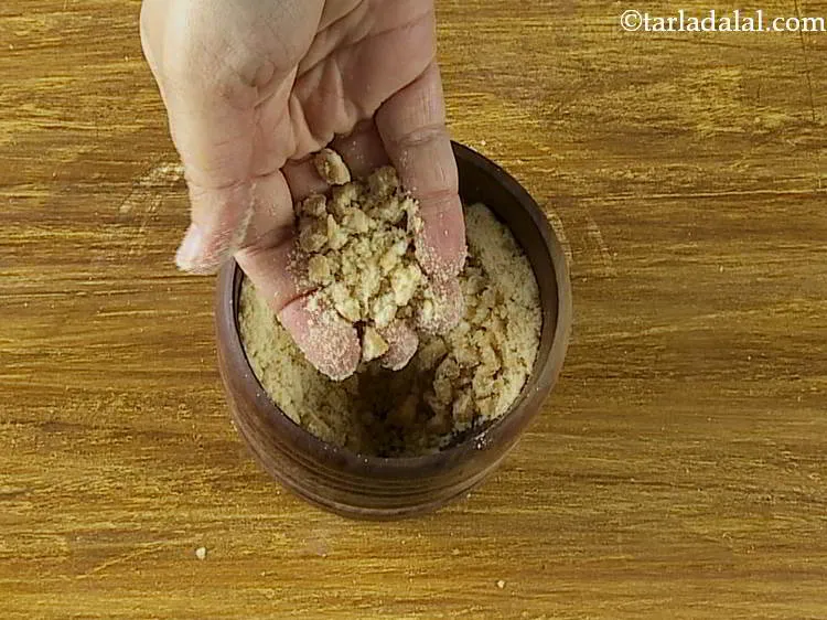 Step 9 – Using a mortar-pestle (khalbatta), powder&nbsp;<strong>Praline (Cashew Praline)</strong>&nbsp;coarsely. Keep aside. It is best to use a …