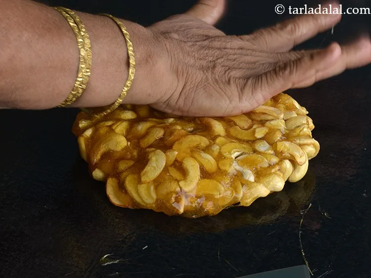 Step 13 – Grease your hands with little ghee and pat it evenly on all the sides with …
