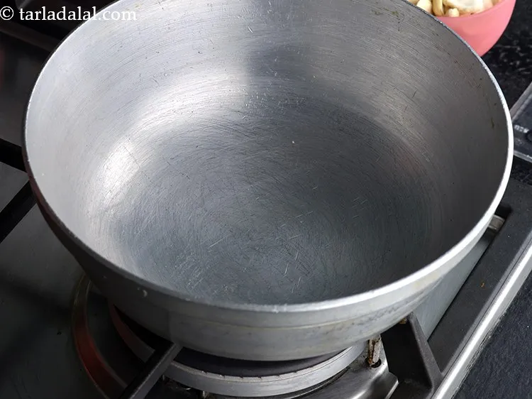 Step 2 – To make <strong>cashew chikki | cashewnut chikki | cashew nut brittle | kaju chikki,</strong> heat …