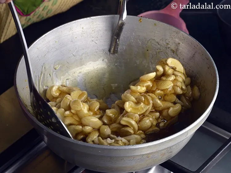 Step 10 – Mix very well. The cashew nuts and the sugar syrup should mix really well to …