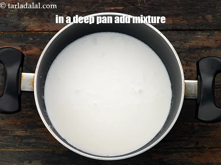 Step 15 – Take a deep non-stick pan and pour the prepared coconut milk-cornflour mixture.&nbsp;