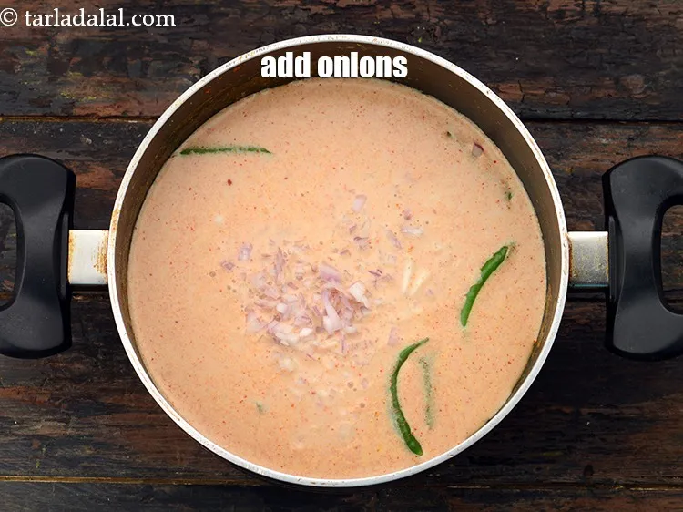 Step 25 – Add 3/4 cup&nbsp;finely&nbsp;<a href="https://www.tarladalal.com/glossary-chopped-onions-722i">chopped onions</a>. This gives a nice flavor.&nbsp;