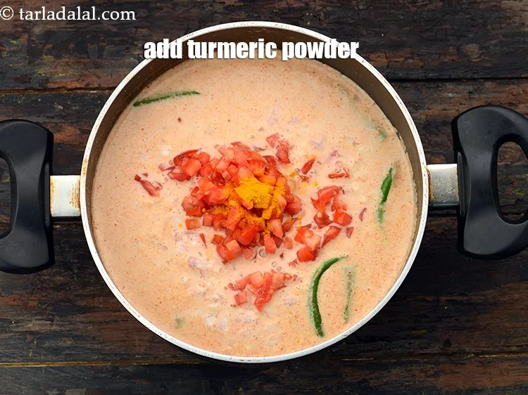Step 27 – Add a pinch of&nbsp;<a href="https://www.tarladalal.com/glossary-turmeric-powder-haldi-645i">turmeric powder (haldi)</a>.&nbsp;