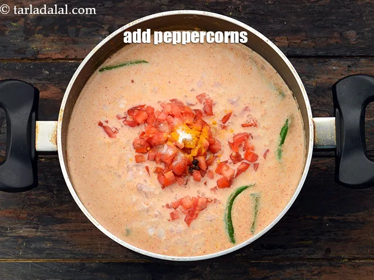 Step 29 – Add <a href="https://www.tarladalal.com/glossary-black-peppercorns-kali-mirch-kalimirch-566i">black peppercorns (kalimirch)</a>.&nbsp;<br /> &nbsp;