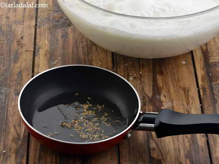 Step 8 – Once the oil is hot, add the cumin seeds.