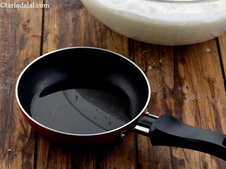 Step 7 – For the tempering of chaas, heat the oil in a small pan. Giving a tadka …