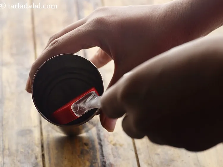 Step 26 – Grease the chakli press with little oil so the dough doesn&#39;t stick to it.