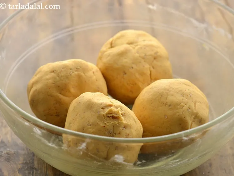 Step 14 – To prepare <strong>crispy chakli</strong> at home, divide the dough into 4 equal portions and keep …