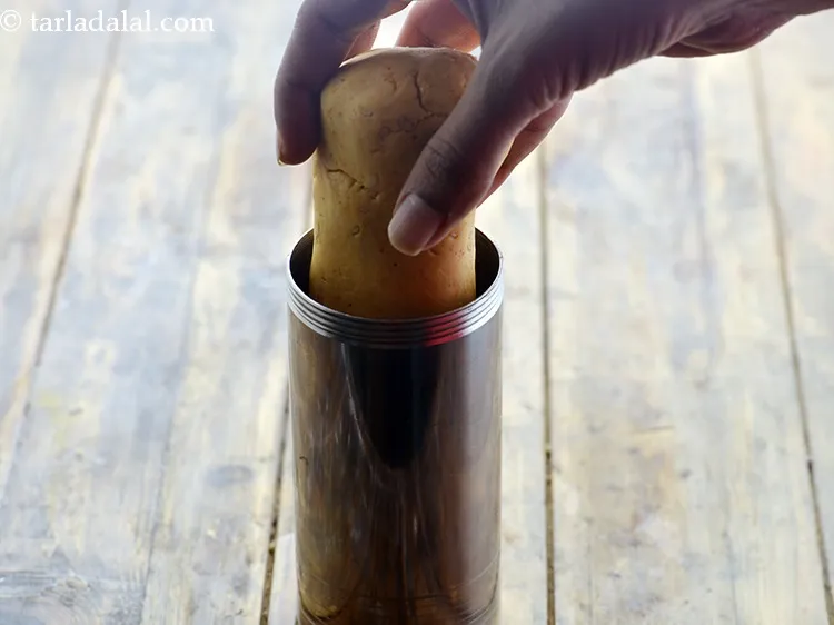 Step 17 – Press out 50 mm. (2&rdquo;) diameter round swirls of chakli onto an inverted flat thali, …