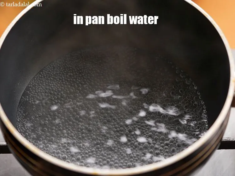 Step 3 – To make <strong>Instant rice chakli</strong>, in a deep pan boil 1 cup of water.