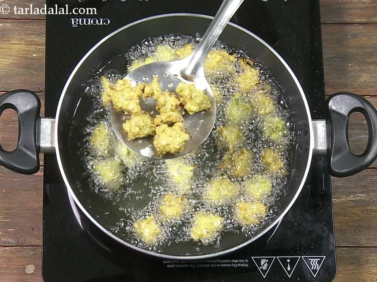 Step 31 – Deep-fry, a few at a time, till they turn crisp and golden brown in colour …