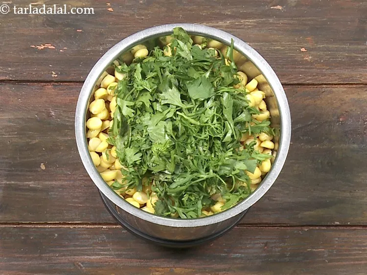 Step 16 – Add 1/4 cup&nbsp;roughly&nbsp;<a href="https://www.tarladalal.com/glossary-chopped-coriander-783i">chopped coriander (dhania)</a>.