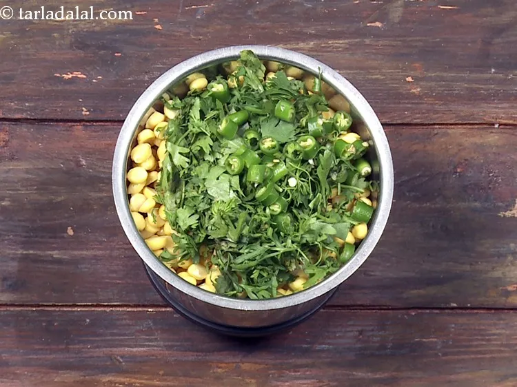 Step 17 – Add 2 tsp&nbsp;roughly&nbsp;<a href="https://www.tarladalal.com/glossary-chopped-green-chilli-820i">chopped green chillies</a>.