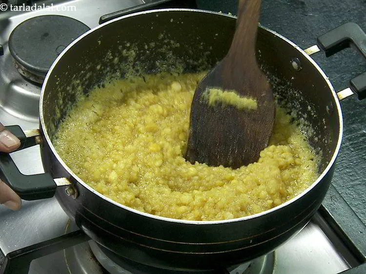 Step 11 – The chana dal will take around 14 minutes to cook on a medium flame. First, …
