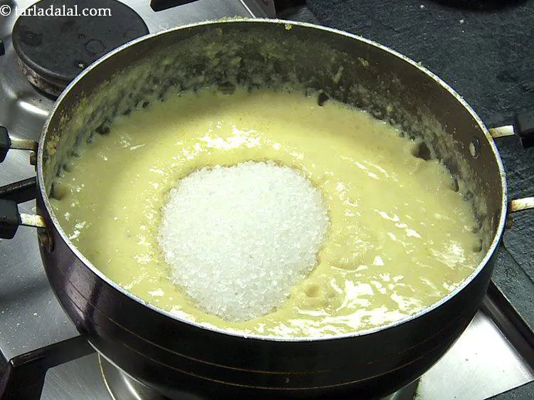 Step 17 – Add the sugar. Always add the sugar, only once the mixture thickens. If the chana …