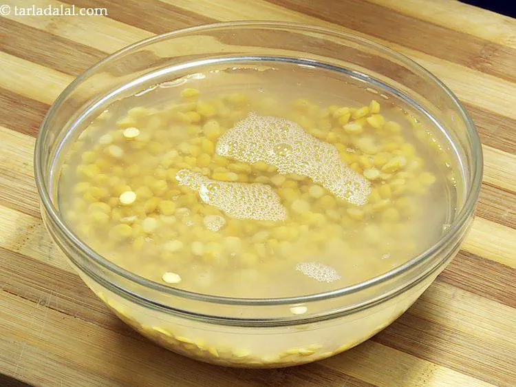 Step 3 – Transfer the chana dal to a bowl and submerge under enough water to soak.
