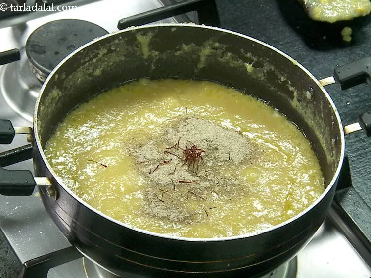 Step 21 – Add saffron. It provides a nice orangish yellow hue to the chana dal halwa.