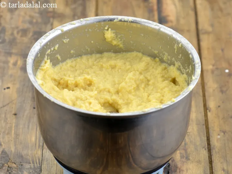 Step 9 – Transfer this soaked and drained chana dal into a mixer,add &frac14; cup of water and …