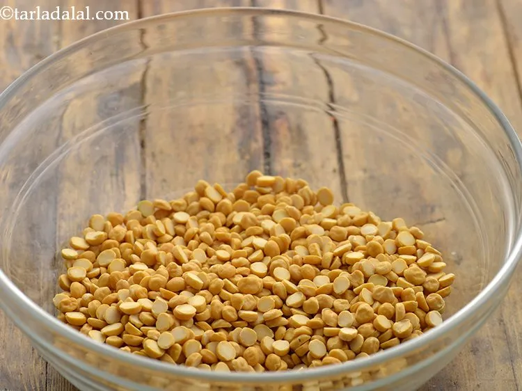 Step 3 – To prepare the mixture for <strong>chana dal vada</strong>, pick and clean 1 cup of chana …